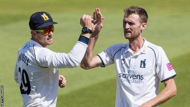 Oliver Hannon-Dalby celebrates taking a wicket against Northants