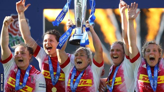 Harlequins captain Rachael Burford lifts the Premier 15s trophy