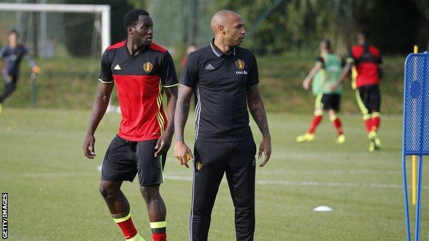 Romelu Lukaku looks on as Thierry Henry coaches a Belgium training session