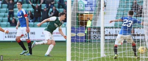 Paul Hanlon rushes off to celebrate scoring Hibs' winner