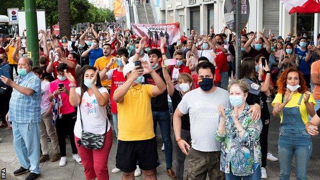 Fans gather outside