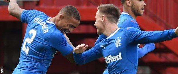 James Tavernier (left) celebrates scoring for Rangers in their opening League Cup match at Motherwell