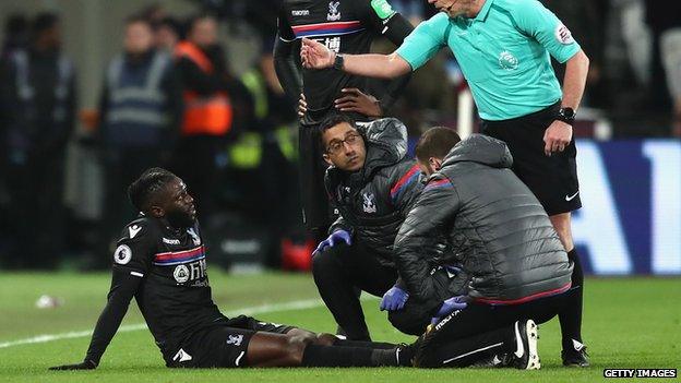 Bakary Sako receives treatment after being injured against West Ham