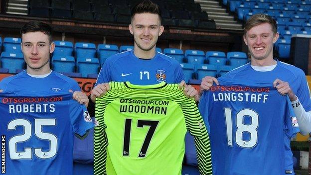 Cal Roberts, Freddie Woodman and Sean Longstaff pose with Kilmarnock shirtt