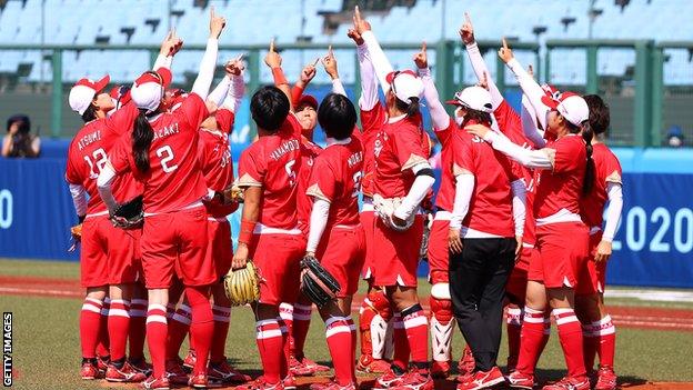 Team Japan celebrate their victory over Australia