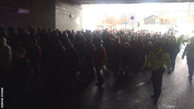 Fans marching in protest before before Saturday's match