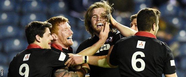 Ben Toolis celebrates scoring for Edinburgh