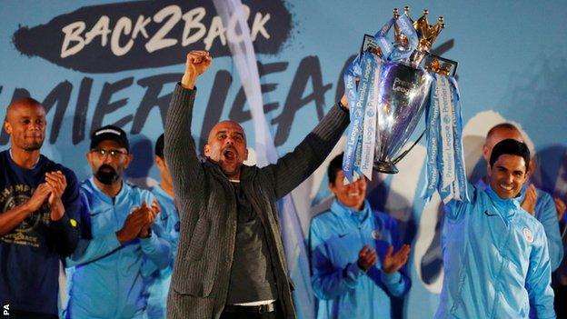 Manager Pep Guardiola celebrated on stage alongside assistant Mikel Arteta