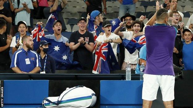 Nick Kyrgios applauds the crowd