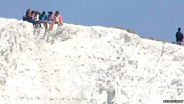 People on cliff edge