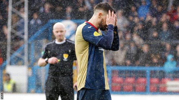 Paul Woods holds his head in his hands after missing his penalty for East Kilbride against Cowdenbeath