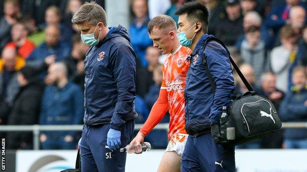 Shayne Lavery was forced off in the first-half of Blackpool's win over Blackburn