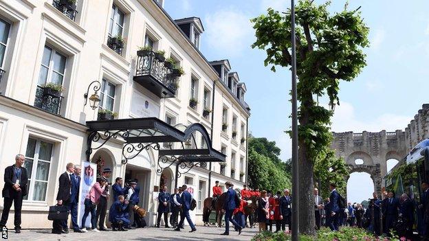 Media outside England's hotel as the players arrive from the team bus