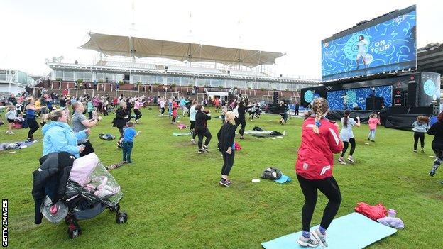 Parents and children take part in The Body Coach aka Joe Wicks' UK PE Tour