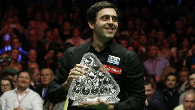 Ronnie O'Sullivan celebrates with the Masters trophy