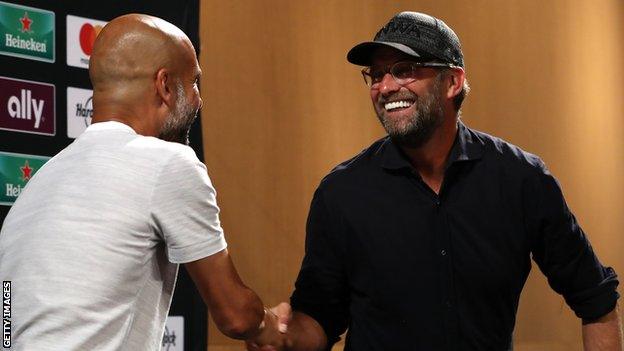 Manchester City boss Pep Guardiola and Liverpool counterpart Jurgen Klopp shake hands