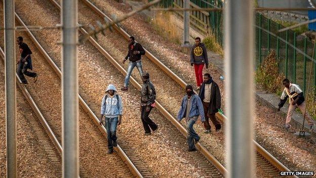 Migrants on rail tracks in Calais