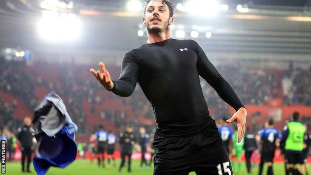 Adam Smith throws his Bournemouth shirt into the crowd at Southampton