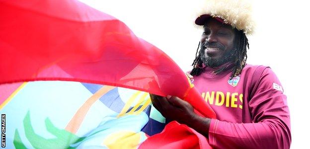 Chris Gayle signs a West Indies flag