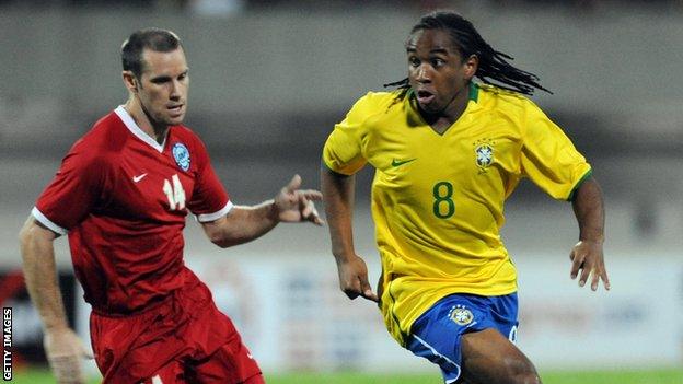 John Wilkinson playing for Singapore against Brazil's Anderson