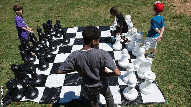 Children playing outside chess