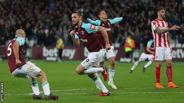 Andy Carroll celebrates scoring for West Ham against Stoke City