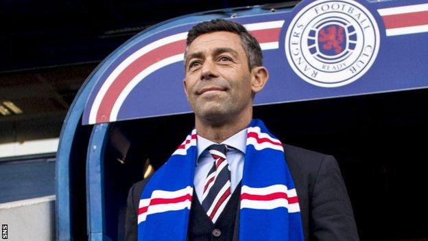 Pedro Caixinha with a Rangers scarf at Ibrox