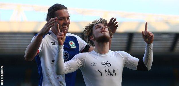 Sam Gallagher and Harvey Elliott celebrate a goal against Blackburn Rovers