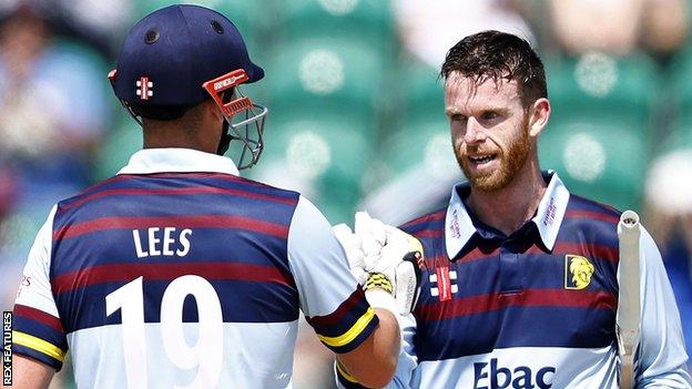 Durham's Alex Lees (left) congratulates Graham Clark on his century