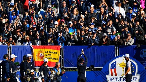 Europe's Rory McIlroy performs the viking clap in front of fans during a Ryder Cup practice round