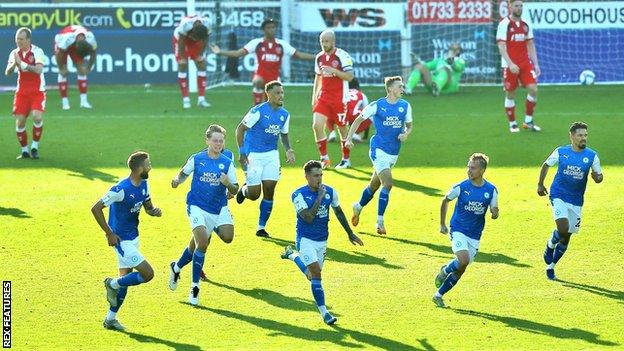 Sammie Szmodics celebrates his late winner for Peterborough