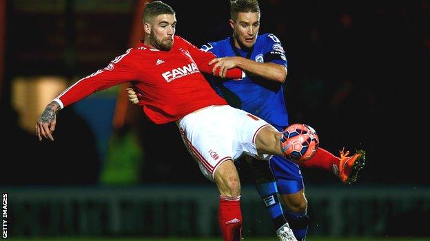 Nottingham Forest's Lars Veldwijk battles for possession with Oliver Lancashire of Rochdale