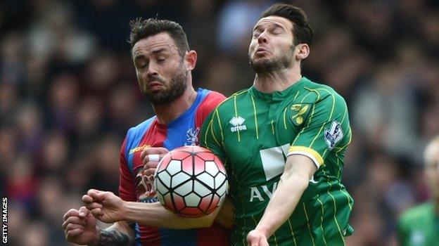 Damien Delaney barges over Matt Jarvis