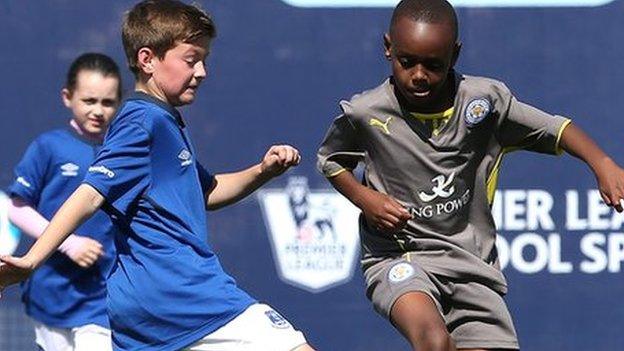 Kids playing football