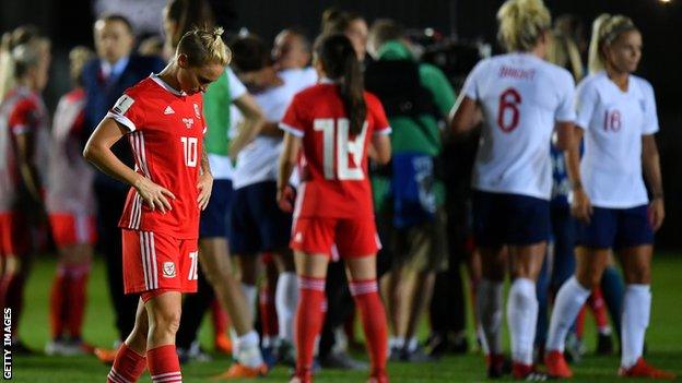 Jessica Fishlock of Wales looks dejected as England celebrate