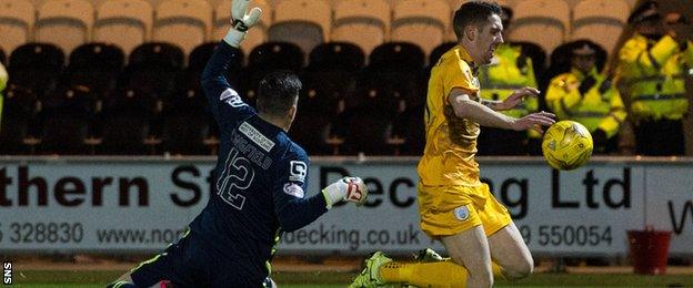 Stefan McCluskey goes down under Jamie Langfield's challenge