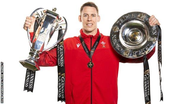 Liam Williams with the Triple Crown and Six Nations trophies