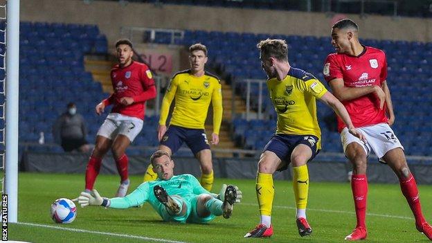 Mikael Mandron opens the scoring for Crewe at Oxford