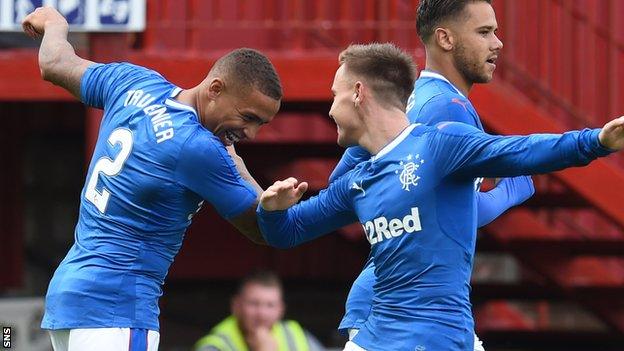 James Tavernier (left) celebrates scoring for Rangers in their opening League Cup match at Motherwell