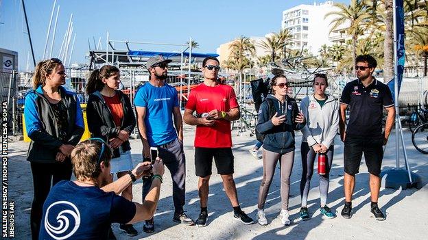 Hannah Mills addresses sailors before beach clean