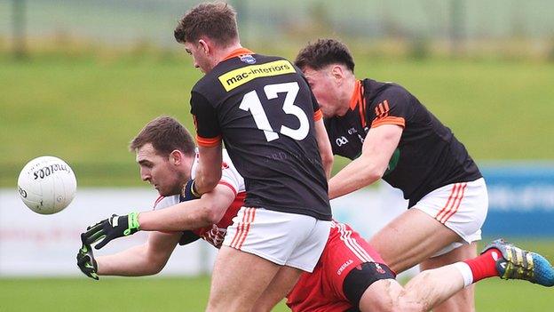 Derry forward Ryan Bell comes under pressure from Orchard duo Anthony Duffy and Stephen Sheridan