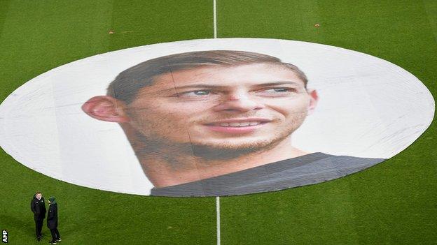 A banner of Emiliano Sala laid on the pitch before kick off