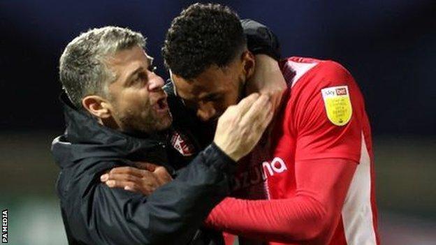 Morecambe manager Stephen Robinson and Jonah Ayunga