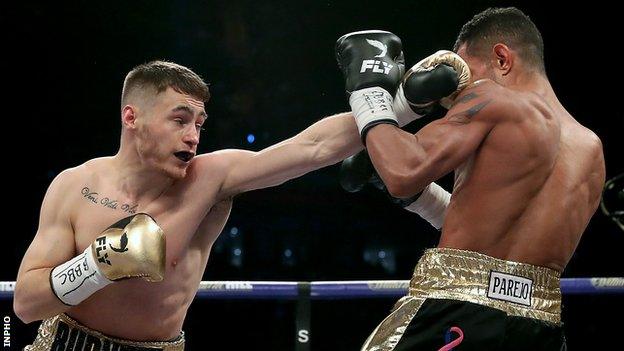 Ryan Burnett lands a left on Yonfrez Parejo in the WBA world bantamweight title bout in Cardiff