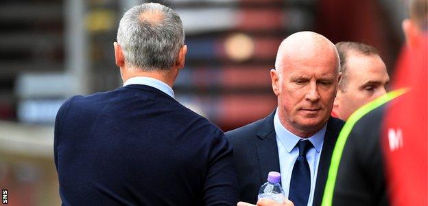 Ray McKinnon and Peter Houston shake hands