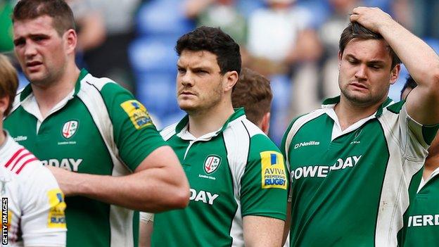 London Irish players following defeat by Harlequins