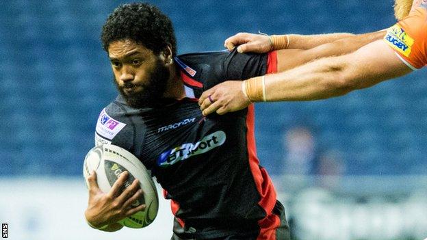 Sasa Tofilau holds off a Newcastle tackle in Edinburgh's second pre-season match