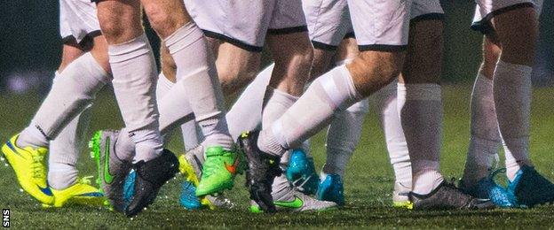 East Kilbride captain Barry Russell's odd boots