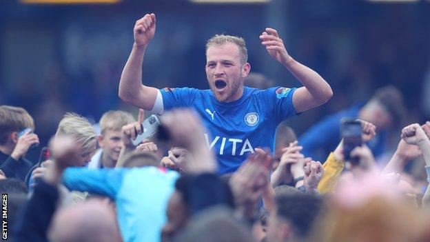 Ryan Croasdale celebrates winning the National League with Stockport County fans