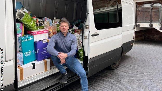 Stuart Meaker sits in his van, surrounded by supplies which he will deliver to Poland, to then be transported to Ukraine